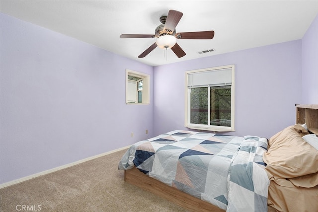 bedroom featuring light carpet and ceiling fan