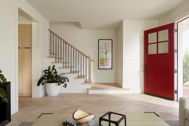 foyer entrance featuring light parquet floors