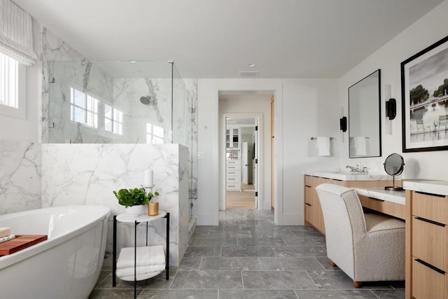 bathroom featuring shower with separate bathtub and vanity