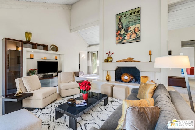 living room with wood ceiling and vaulted ceiling with beams