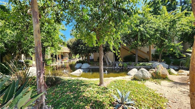 view of yard with a small pond