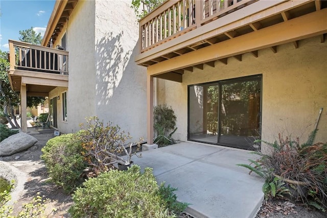 doorway to property featuring a patio area and a balcony