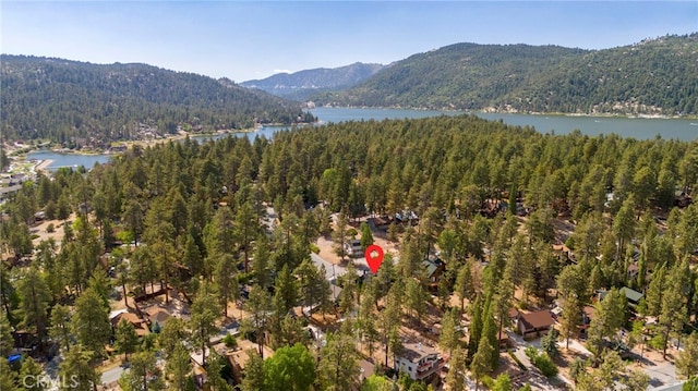 aerial view featuring a water and mountain view