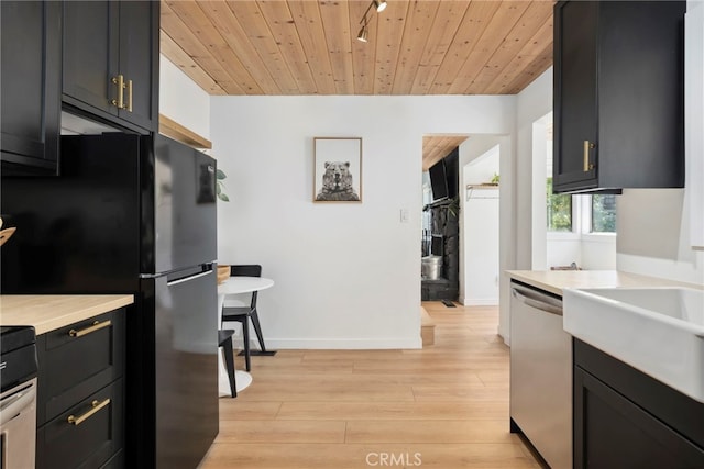 kitchen featuring light wood-type flooring, wood ceiling, stainless steel dishwasher, and black fridge