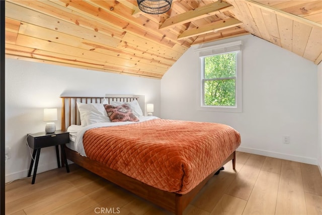 bedroom with wooden ceiling, vaulted ceiling with beams, and wood-type flooring