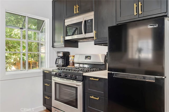 kitchen featuring appliances with stainless steel finishes and plenty of natural light