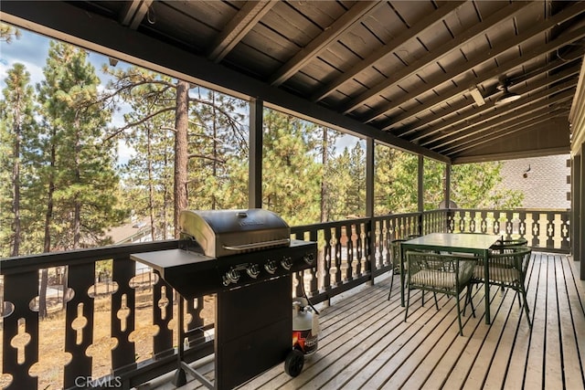 wooden terrace featuring a grill