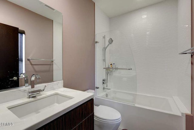 full bathroom featuring vanity, toilet, and tiled shower / bath combo