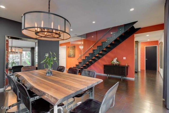 dining space with an inviting chandelier