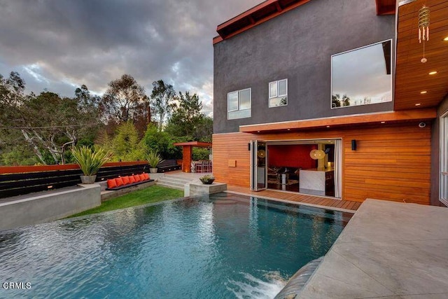 view of pool featuring a patio area