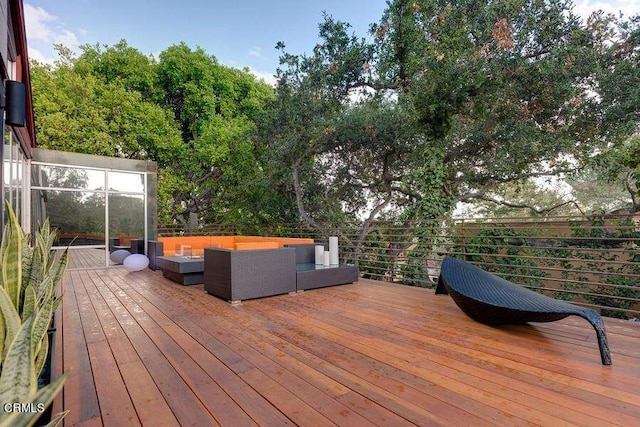 deck featuring outdoor lounge area