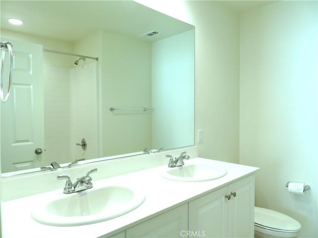 bathroom with vanity and toilet