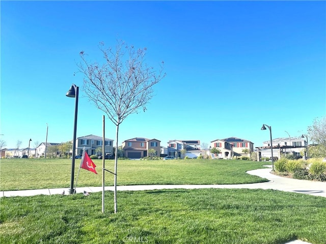 view of property's community with a yard