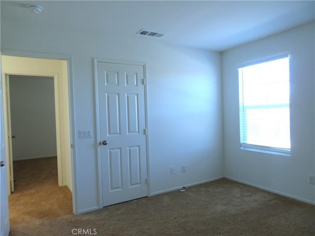 unfurnished bedroom with carpet floors