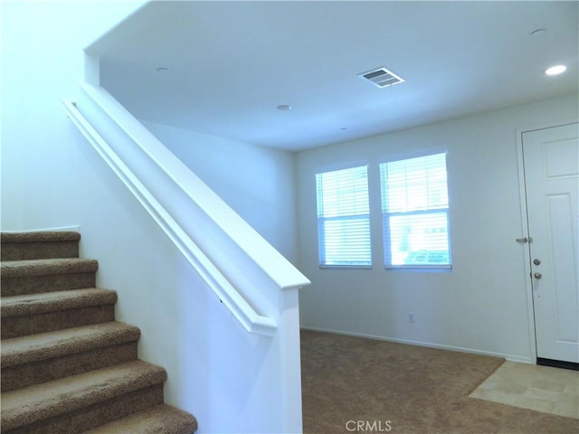 stairway with carpet floors