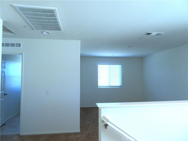 interior space featuring dark colored carpet