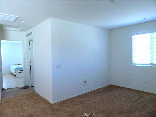 view of carpeted spare room