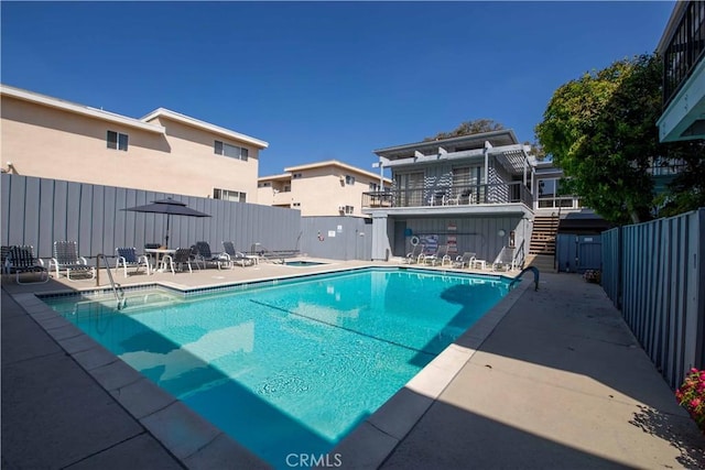 view of swimming pool with a patio