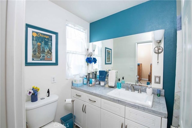 bathroom with vanity and toilet