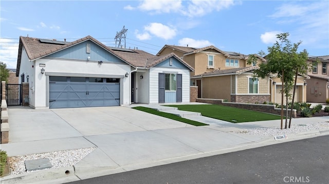 view of front of home with a front lawn and a garage