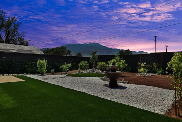 yard at dusk with a mountain view