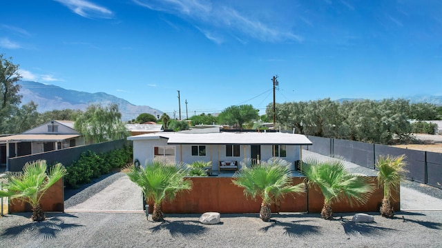 back of property with a mountain view