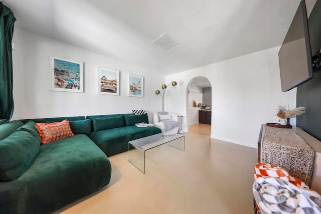 living room featuring concrete flooring