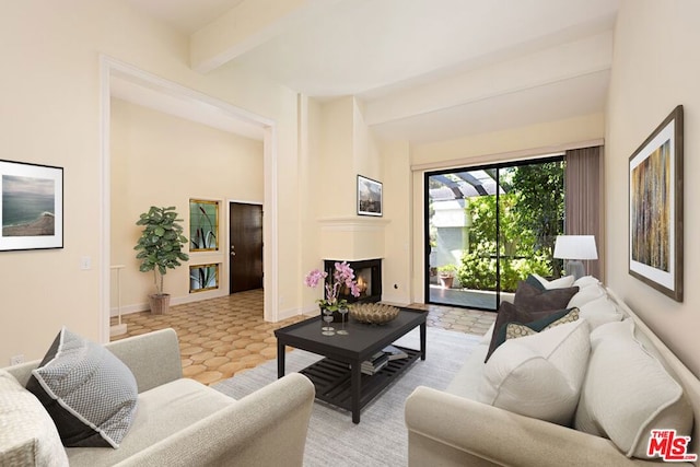 living room with beamed ceiling