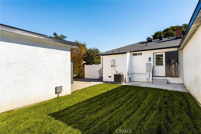 view of yard with a patio area and central AC unit