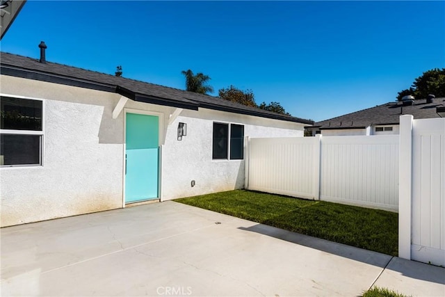 entrance to property with a patio area