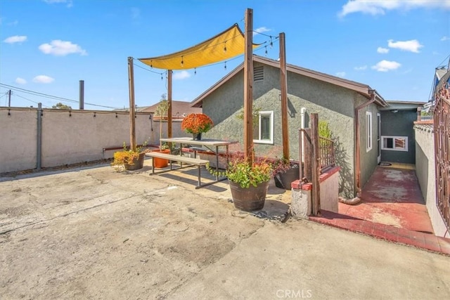 back of house with a patio area