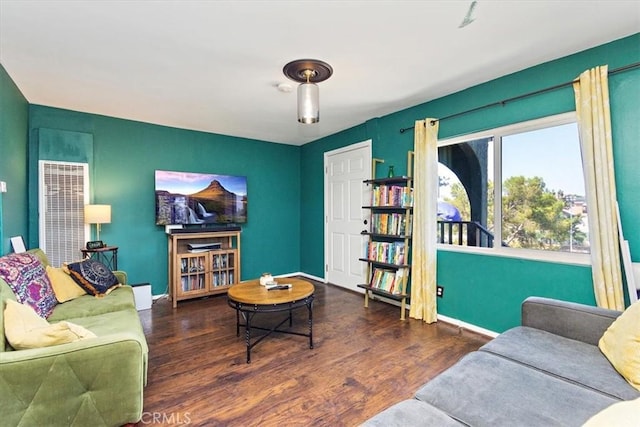 living room featuring dark hardwood / wood-style flooring