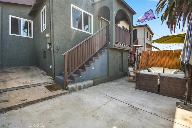 rear view of house featuring a patio and an outdoor hangout area