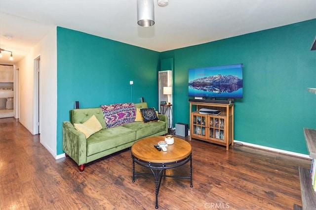 living room with dark hardwood / wood-style floors