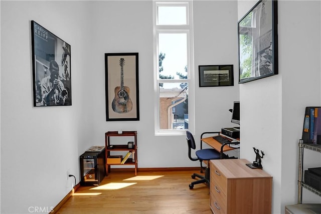 office area featuring a wealth of natural light and light hardwood / wood-style floors