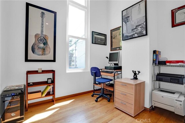 office area with light hardwood / wood-style floors