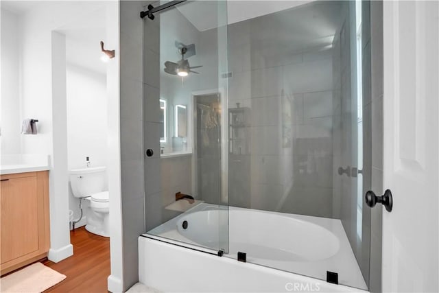 full bathroom featuring vanity, shower / bath combination with glass door, toilet, and wood-type flooring