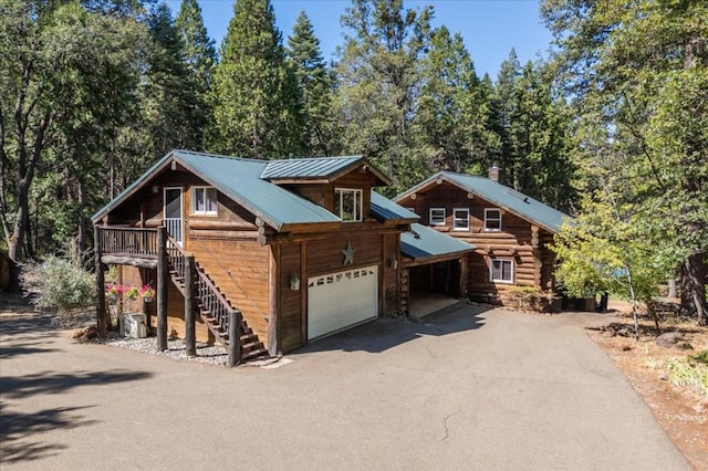 log home with a garage