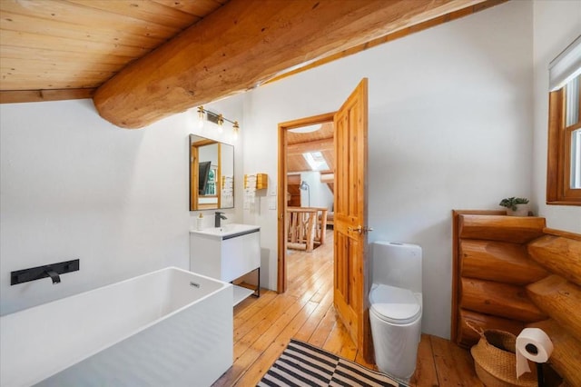 bathroom featuring vanity, toilet, wood ceiling, a tub to relax in, and hardwood / wood-style floors