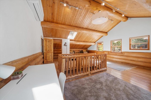 additional living space featuring lofted ceiling with skylight, wood ceiling, hardwood / wood-style floors, and a wall mounted AC