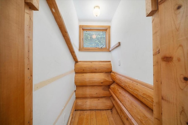 interior space featuring lofted ceiling and wood-type flooring