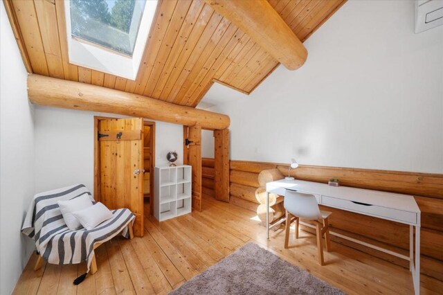 office area with vaulted ceiling with skylight, wood-type flooring, and wood ceiling