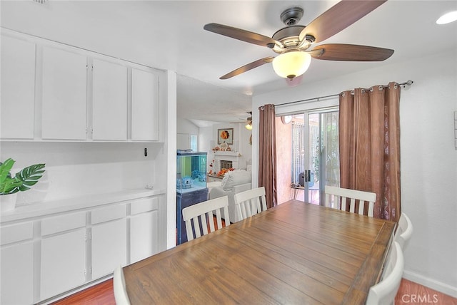 dining room featuring ceiling fan and light hardwood / wood-style floors