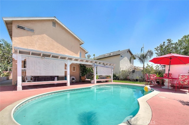 view of swimming pool featuring a patio area and a pergola