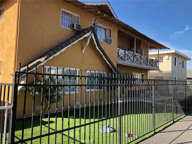 view of gate featuring a yard