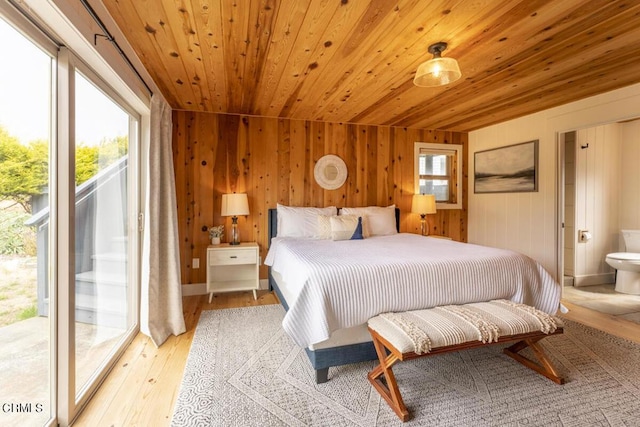 bedroom featuring access to outside, light hardwood / wood-style flooring, multiple windows, and wooden ceiling