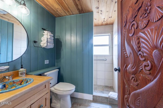 bathroom featuring wood ceiling, vanity, tile patterned flooring, toilet, and wood walls