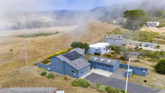 birds eye view of property featuring a rural view