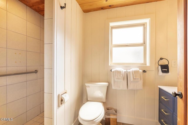 bathroom with wood walls, wooden ceiling, and toilet