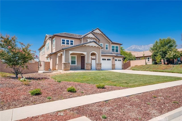 craftsman-style home with a front yard and a garage